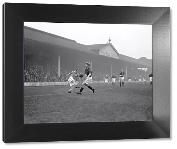 Millwall vs Nottingham Forest: Intense Moment in Division Two Soccer Match - Jimmy Richardson Attempts to Cross the Ball