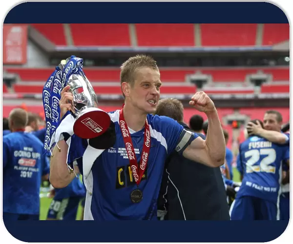 The Glory of Millwall: Paul Robinson's Triumphant Trophy Lift after Winning the Play-Off Final at Wembley Stadium against Swindon Town (Coca-Cola Football League One)