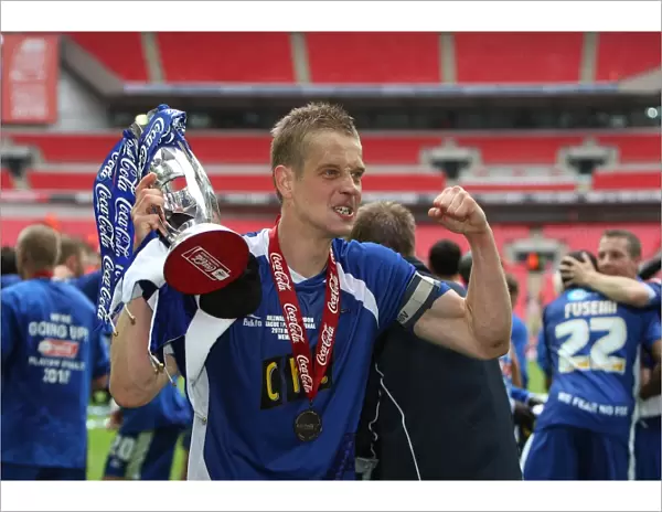 The Glory of Millwall: Paul Robinson's Triumphant Trophy Lift after Winning the Play-Off Final at Wembley Stadium against Swindon Town (Coca-Cola Football League One)