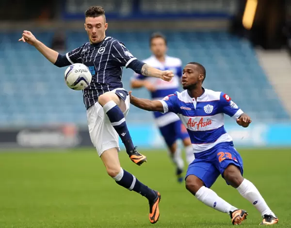 Millwall vs. Queens Park Rangers: Sky Bet Championship Clash at The New Den - Scott Malone and Junior Hoilett Battle It Out