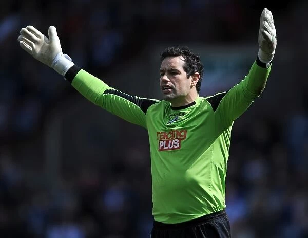 Millwall's David Forde Saves Huddersfield Town's Penalty in Championship Clash at John Smith's Stadium (20-04-2013)