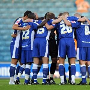Millwall Players Unite in Huddle during Coca-Cola Football League One Match against Oldham Athletic at The New Den