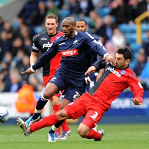 Millwall vs Portsmouth: Intense Battle – Guessan vs Rocha in Npower Championship Match at The Den (26-12-2011)
