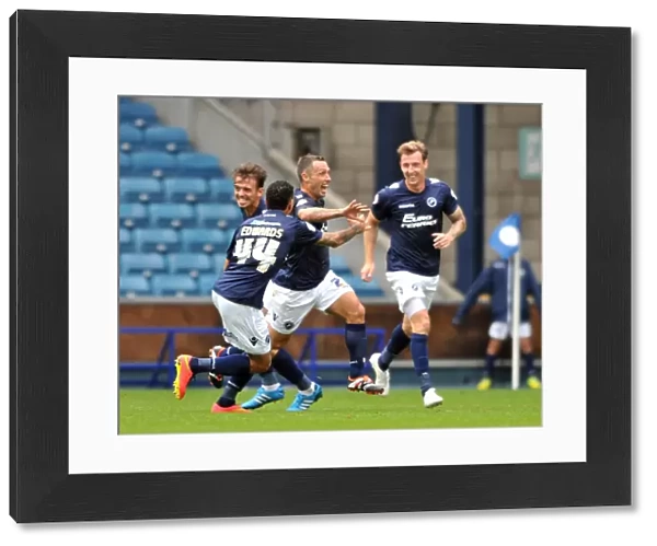 Millwall's Scott McDonald Scores First Goal: Celebrating with Team Mates in Sky Bet Championship Match against Blackpool at The Den
