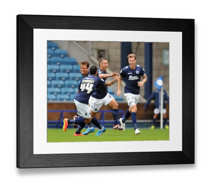 Framed Print : Millwall's Scott McDonald Scores First Goal: Celebrating with Team Mates in Sky Bet Championship Match against Blackpool at The Den Framed Print : Millwall's Scott McDonald Scores First Goal: Celebrating with Team Mates in Sky Bet Championship Match against Blackpool at The Den
