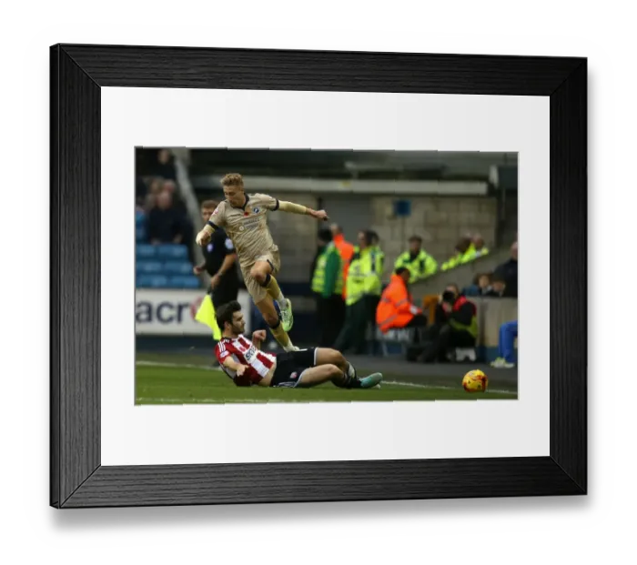 Framed Print : Millwall vs. Brentford: Lee Martin vs. Jon Toral Tackle in Sky Bet Championship at The Den Framed Print : Millwall vs. Brentford: Lee Martin vs. Jon Toral Tackle in Sky Bet Championship at The Den