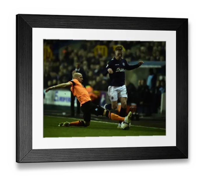 Framed Print : Battle for Supremacy: Millwall's Aiden O'Brien vs Brighton's Bruno Saltor (Sky Bet Championship)