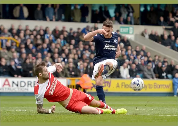 Millwall vs Charlton Athletic: Intense Clash at The Den - Roger Johnson Defends Against Lee Gregory's Shot (Sky Bet Championship)
