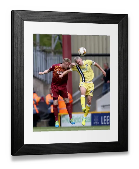 Framed Print : Bradford City vs Millwall: Intense Aerial Battle Between Steve Morison and Nathan Clarke in Play-Off First Leg Framed Print : Bradford City vs Millwall: Intense Aerial Battle Between Steve Morison and Nathan Clarke in Play-Off First Leg