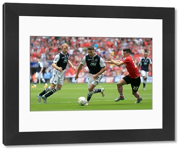 Intense Rivalry: Battle for the Ball - Millwall vs Barnsley in the Sky Bet League One Play-Off Final at Wembley Stadium (2015-16)