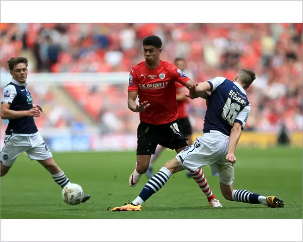 Barnsley vs. Millwall - Intense Battle for the Ball in the Sky Bet League One Play-Off Final at Wembley Stadium