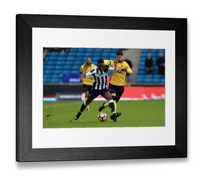 Framed Print : Millwall vs Watford in Emirates FA Cup: Onyedinma and Britos Clash for Ball at The Den