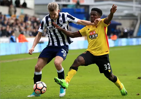 Millwall vs. Watford: Intense Battle for the Ball in FA Cup Fourth Round at The Den