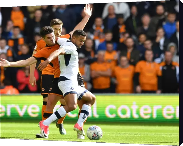 Wolverhampton Wanderers vs Millwall: Intense Battle for Possession - Ben Marshall vs James Meredith
