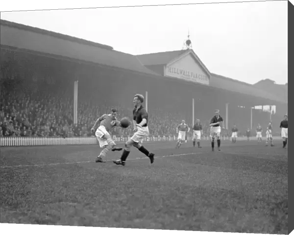 Millwall vs Nottingham Forest: Intense Moment in Division Two Soccer Match - Jimmy Richardson Attempts to Cross the Ball