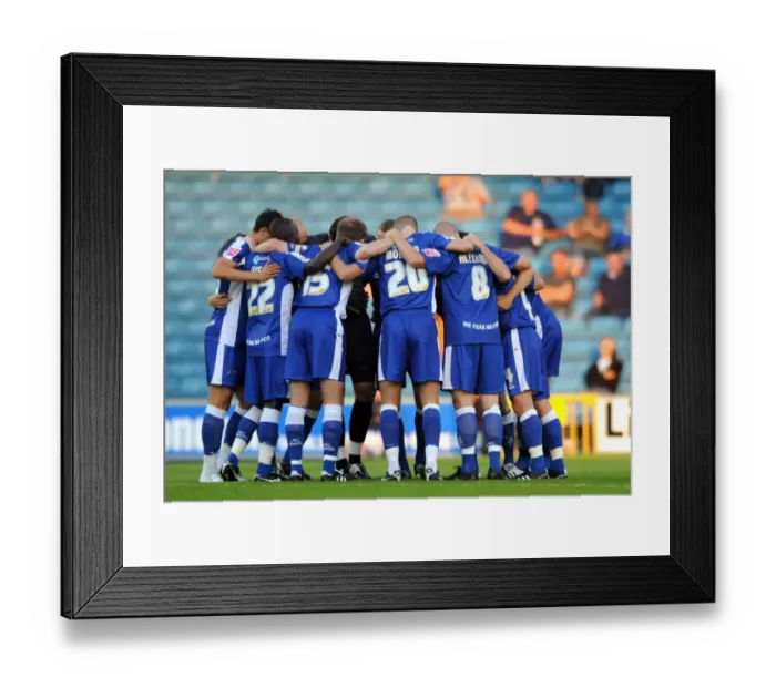 Framed Print : Millwall Players Unite in Huddle during Coca-Cola Football League One Match against Oldham Athletic at The New Den Framed Print : Millwall Players Unite in Huddle during Coca-Cola Football League One Match against Oldham Athletic at The New Den