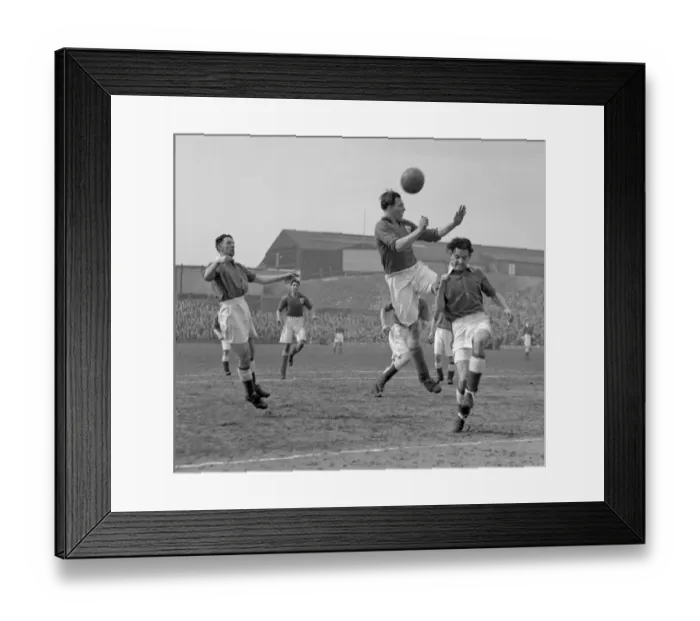 Framed Print : Millwall vs Leeds United: Albert Wakefield's Header Attempt at The Den Framed Print : Millwall vs Leeds United: Albert Wakefield's Header Attempt at The Den