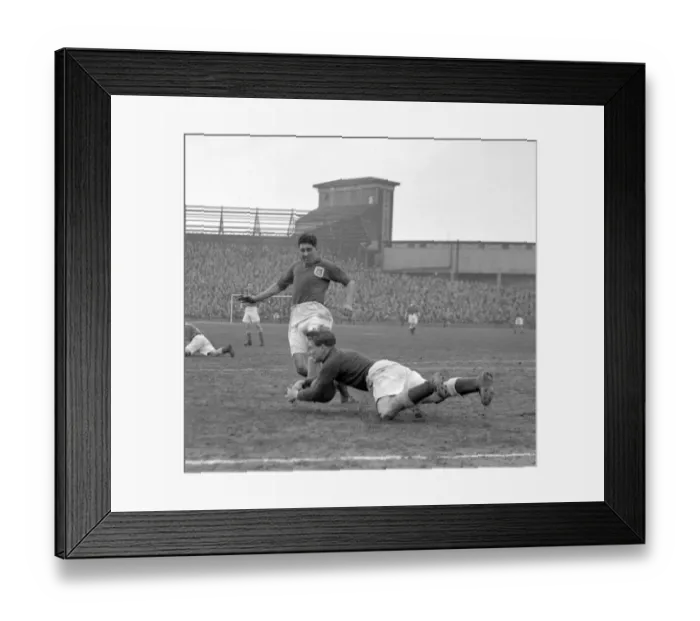 Framed Print : Intense Moment: Ken Chisholm Tackles Malcolm Finlayson in Millwall vs Leeds United Soccer Match