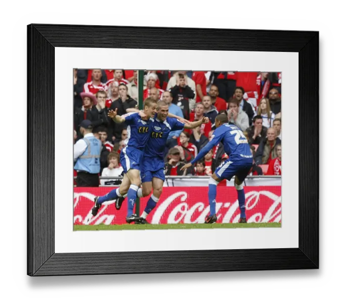 Framed Print : Millwalls Paul Robinson (left) celebrates with his team mates after scoring the opening goal