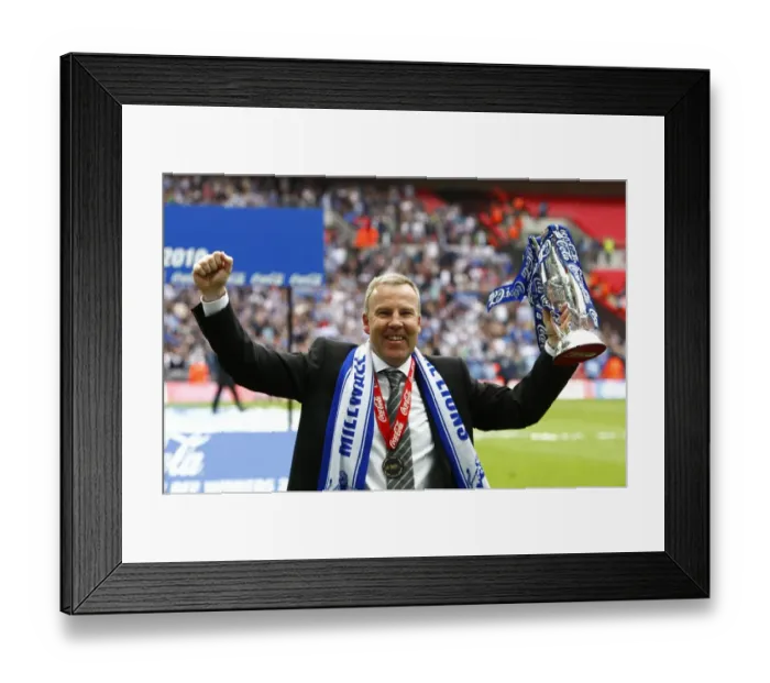 Framed Print : Millwall's Triumph: Kenny Jackett and The Lions Celebrate Promotion to League One with the Play-Off Trophy at Wembley