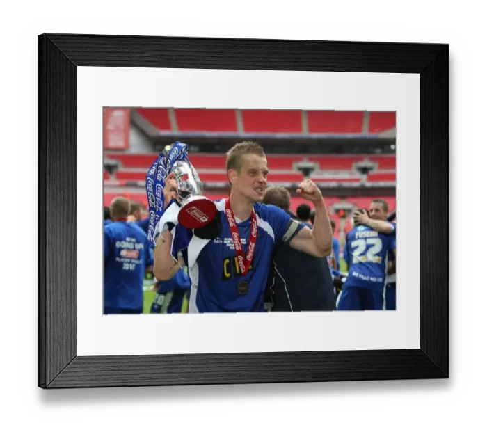 Framed Print : The Glory of Millwall: Paul Robinson's Triumphant Trophy Lift after Winning the Play-Off Final at Wembley Stadium against Swindon Town (Coca-Cola Football League One)