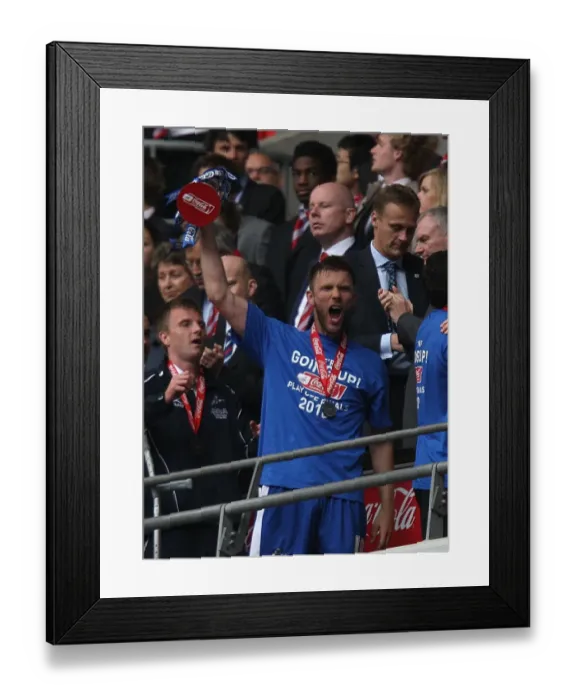 Framed Print : Millwall FC Celebrates Promotion to League One: Darren Ward Lifts the Play-Off Trophy at Wembley Stadium Framed Print : Millwall FC Celebrates Promotion to League One: Darren Ward Lifts the Play-Off Trophy at Wembley Stadium