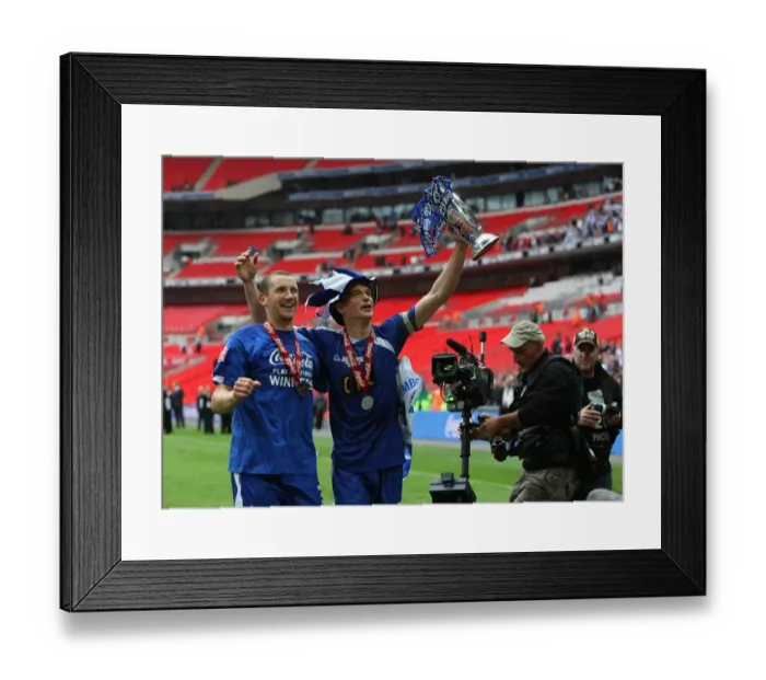 Framed Print : Millwall's Triumph: Frampton and Robinson Rejoice with the Football League One Play-Off Trophy at Wembley
