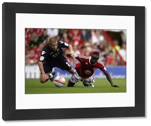 Battle for Supremacy: Dunne vs. Adomah in the Npower Championship Clash between Millwall and Bristol City (07-08-2010)