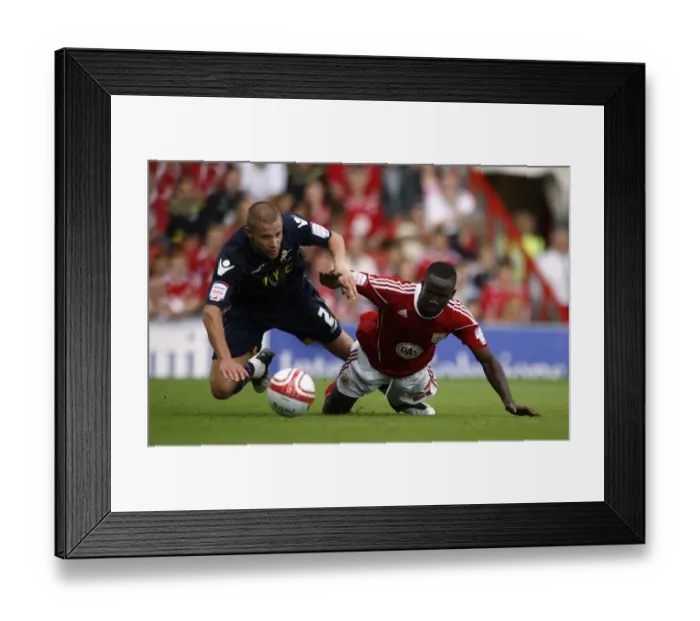 Framed Print : Battle for Supremacy: Dunne vs. Adomah in the Npower Championship Clash between Millwall and Bristol City (07-08-2010) Framed Print : Battle for Supremacy: Dunne vs. Adomah in the Npower Championship Clash between Millwall and Bristol City (07-08-2010)