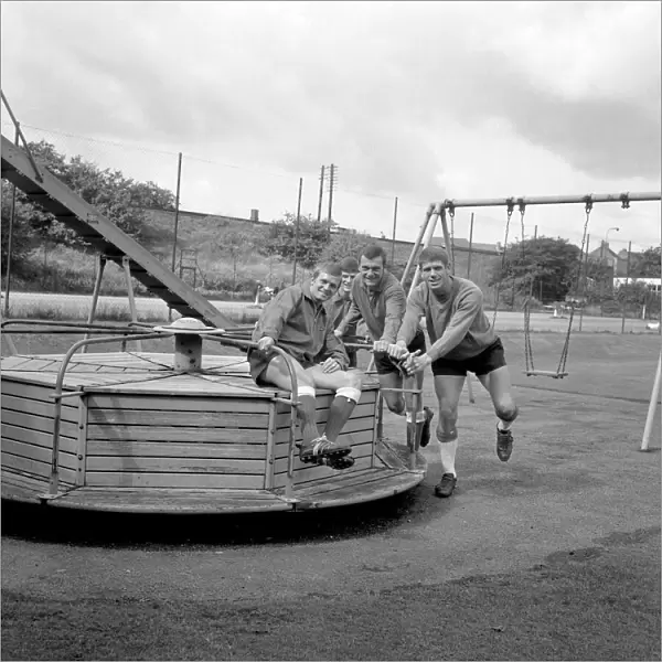 Millwall Football Club: Pre-Season Laughs - New Signing Derek Possee Rides a Roundabout with Team-Mates Lawrie Leslie, Keith Weller, and William Neil