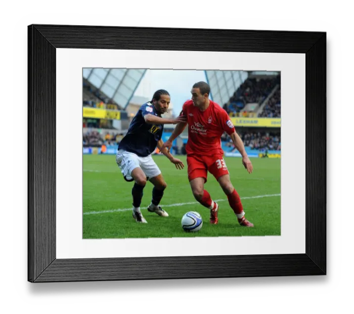 Framed Print : Millwall vs. Nottingham Forest: A Championship Battle at The New Den - Tamika Mkandawire vs. Joel Lynch (26-02-2011) Framed Print : Millwall vs. Nottingham Forest: A Championship Battle at The New Den - Tamika Mkandawire vs. Joel Lynch (26-02-2011)