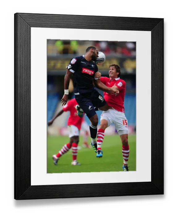 Framed Print : Millwall vs. Nottingham Forest: Intense Aerial Battle between Liam Trotter and Chris Cohen in the Npower Championship (13-08-2011) Framed Print : Millwall vs. Nottingham Forest: Intense Aerial Battle between Liam Trotter and Chris Cohen in the Npower Championship (13-08-2011)