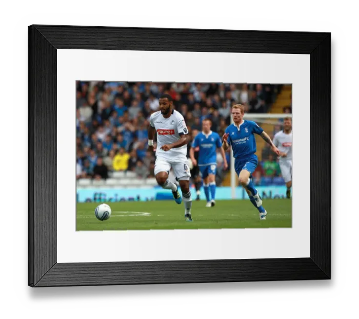 Framed Print : Chasing Glory: Burke Pursues Trotter in Intense Championship Clash between Birmingham City and Millwall