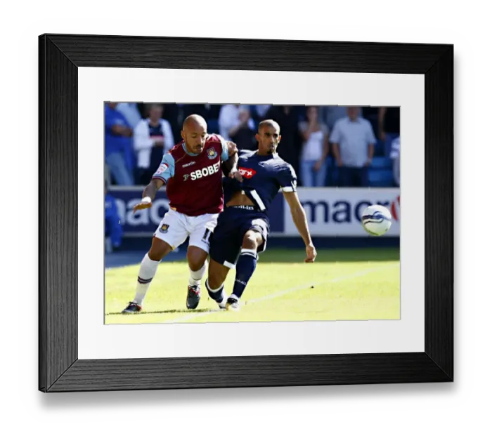 Framed Print : Millwall vs. West Ham United: A Championship Battle at The Den - Faubert vs. Bouazza