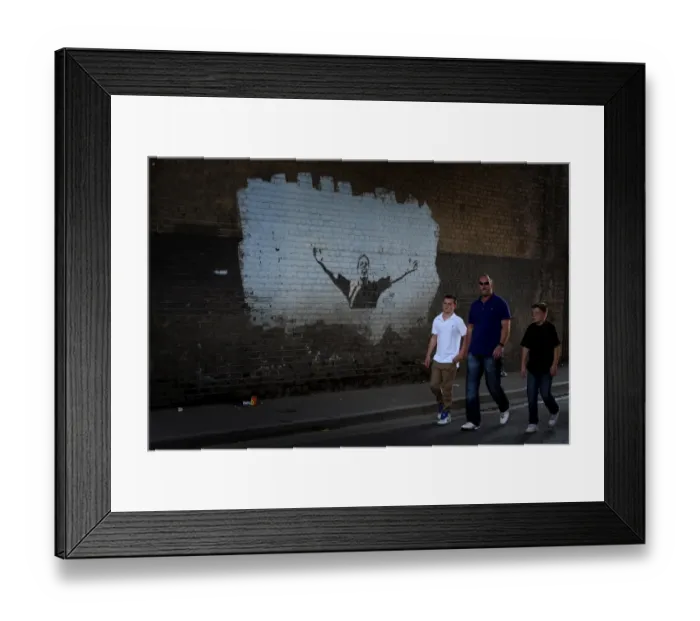 Framed Print : Millwall vs Burnley: The Den - Passionate Fans Make Their Way to the Npower Championship Match (10-01-2011)