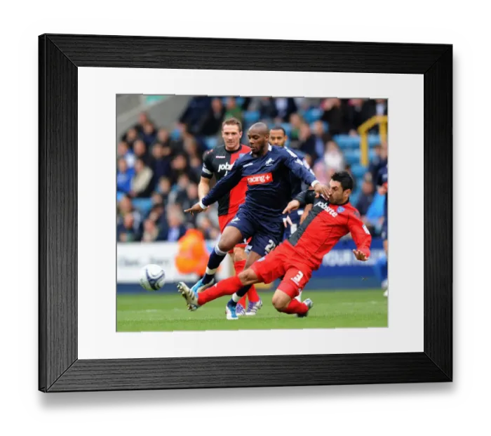 Framed Print : Millwall vs Portsmouth: Intense Battle – Guessan vs Rocha in Npower Championship Match at The Den (26-12-2011) Framed Print : Millwall vs Portsmouth: Intense Battle – Guessan vs Rocha in Npower Championship Match at The Den (26-12-2011)
