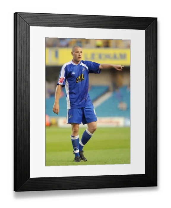 Framed Print : Gary Alexander's Thrilling Performance: Millwall vs Oldham Athletic in Football League One (18-08-2009)