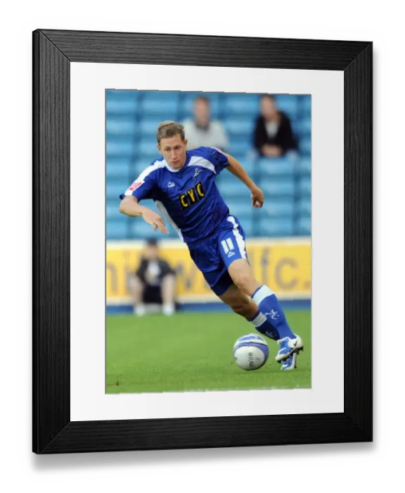Framed Print : David Martin's Unyielding Performance: Millwall vs Oldham Athletic in Football League One (August 18, 2009)