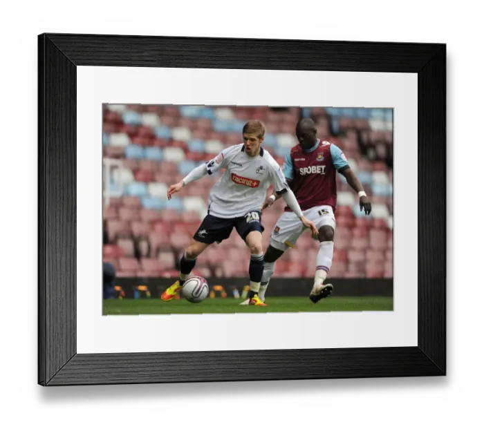 Framed Print : Clash at Upton Park: Andrew Keogh vs. Abdoulaye Faye in Npower Championship Showdown (Millwall vs. West Ham United, 04-02-2012) Framed Print : Clash at Upton Park: Andrew Keogh vs. Abdoulaye Faye in Npower Championship Showdown (Millwall vs. West Ham United, 04-02-2012)