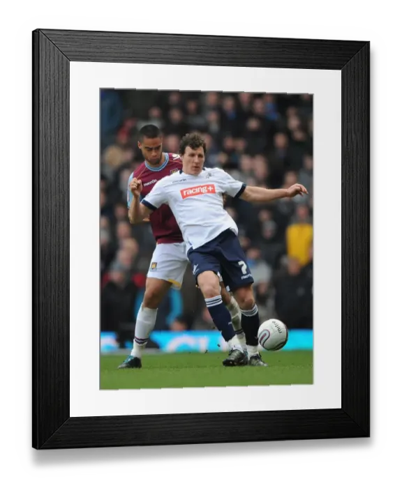 Framed Print : Clash at Upton Park: West Ham United vs. Millwall in Npower Championship Action - Reid and Henderson Go Head to Head Framed Print : Clash at Upton Park: West Ham United vs. Millwall in Npower Championship Action - Reid and Henderson Go Head to Head