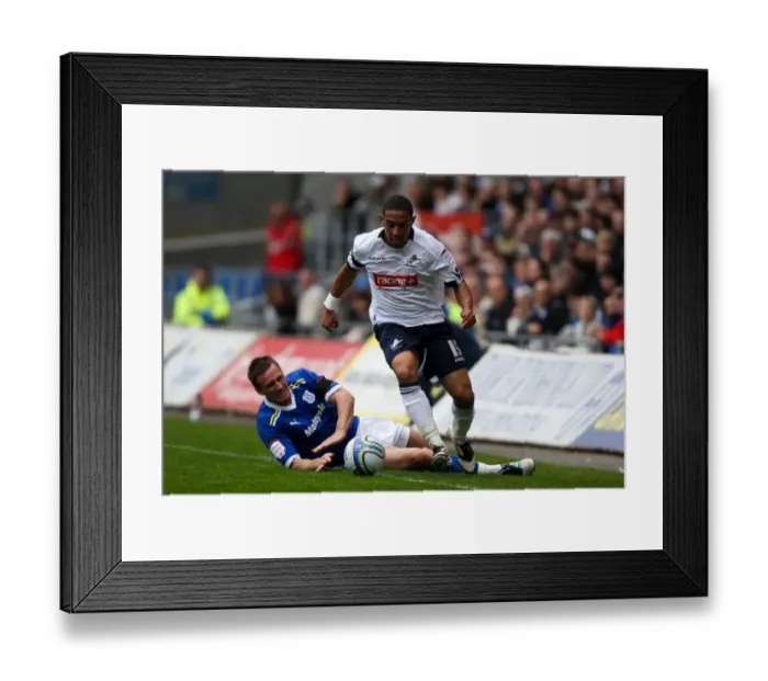 Framed Print : Feeney Escapes Lawrence's Challenge: Millwall vs. Cardiff City, Npower Championship (31-03-2012)