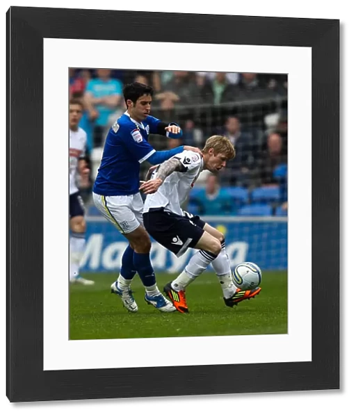 Millwall's Andy Keogh Holds Off Cardiff City's Peter Whittingham in Npower Championship Clash