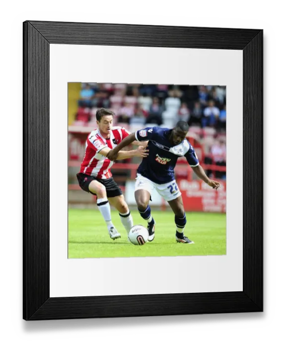 Framed Print : Millwall vs Exeter City: Pre-Season Clash at St James Park - Dany N'Guessan vs Matt Oakley (August 2012) Framed Print : Millwall vs Exeter City: Pre-Season Clash at St James Park - Dany N'Guessan vs Matt Oakley (August 2012)