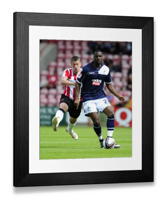 Framed Print : Pre-Season Clash: Exeter City vs. Millwall - Scot Bennett vs. Dany N'Guessan at St James Park (August 4, 2012)