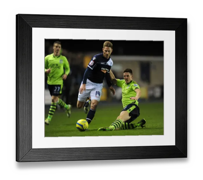 Framed Print : FA Cup Fourth Round Showdown: Henry vs. Clark's Intense Battle at The Den