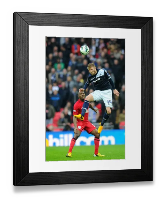 Framed Print : Millwall vs Wigan Athletic: FA Cup Semi-Final Showdown at Wembley Stadium - James Henry Leaps for a Header Framed Print : Millwall vs Wigan Athletic: FA Cup Semi-Final Showdown at Wembley Stadium - James Henry Leaps for a Header