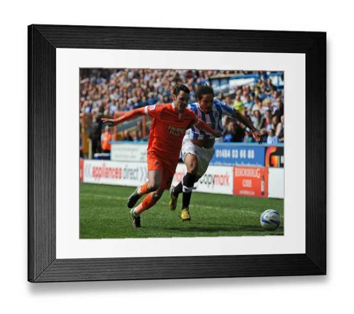 Framed Print : Battle for the Ball: Huddersfield Town vs. Millwall - Npower Championship Rivalry Framed Print : Battle for the Ball: Huddersfield Town vs. Millwall - Npower Championship Rivalry