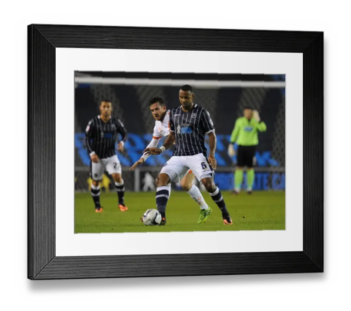 Framed Print : Battle for Supremacy: Trotter vs. Ferguson in Millwall vs. Blackpool Championship Clash Framed Print : Battle for Supremacy: Trotter vs. Ferguson in Millwall vs. Blackpool Championship Clash