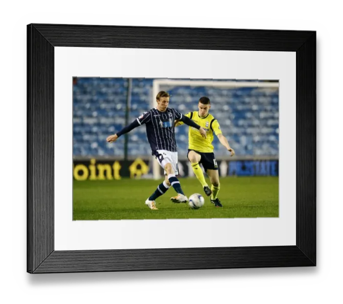 Framed Print : Millwall vs Birmingham City: A Championship Showdown - Woolford Clears the Threat at The Den
