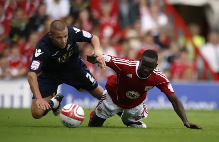 Framed Print : Battle for Supremacy: Dunne vs. Adomah in the Npower Championship Clash between Millwall and Bristol City (07-08-2010) Framed Print : Battle for Supremacy: Dunne vs. Adomah in the Npower Championship Clash between Millwall and Bristol City (07-08-2010)